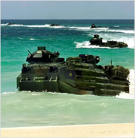 A group of tanks in the ocean with boats.