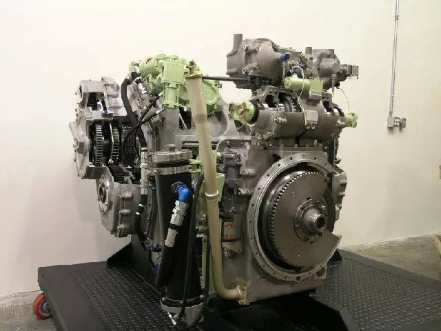 A large engine with many parts on it